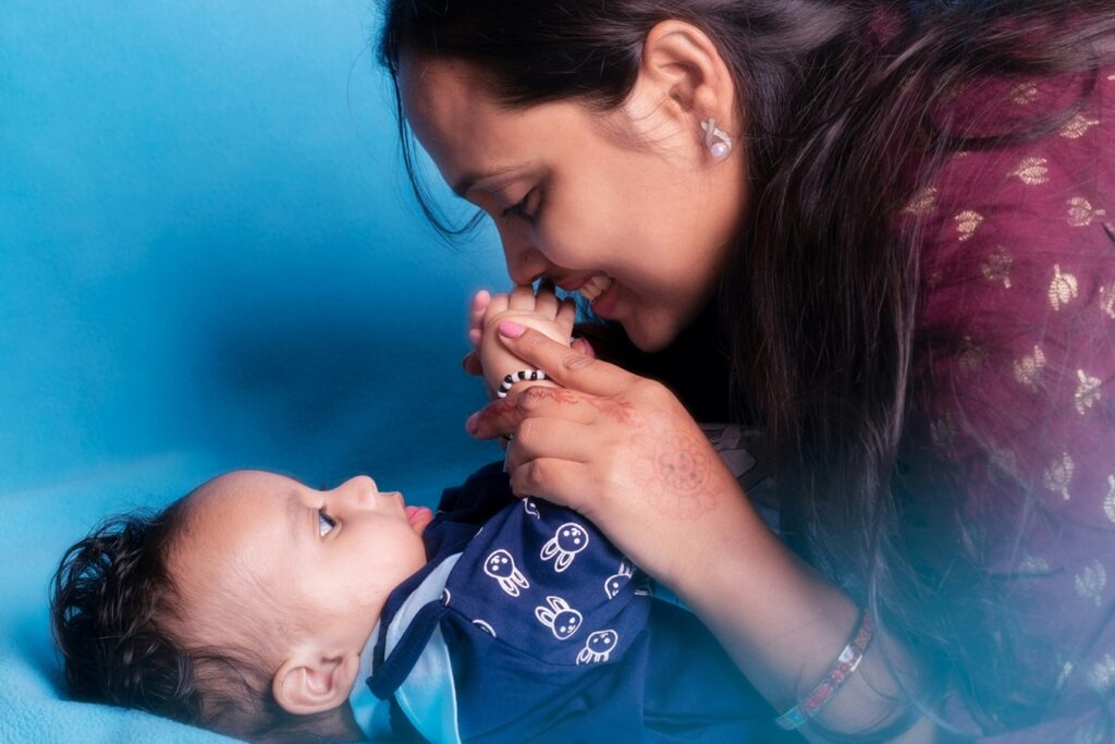 mom looking happily at child