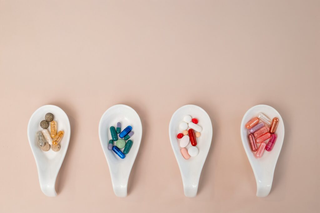 tablets and capsules served on medicine spoons