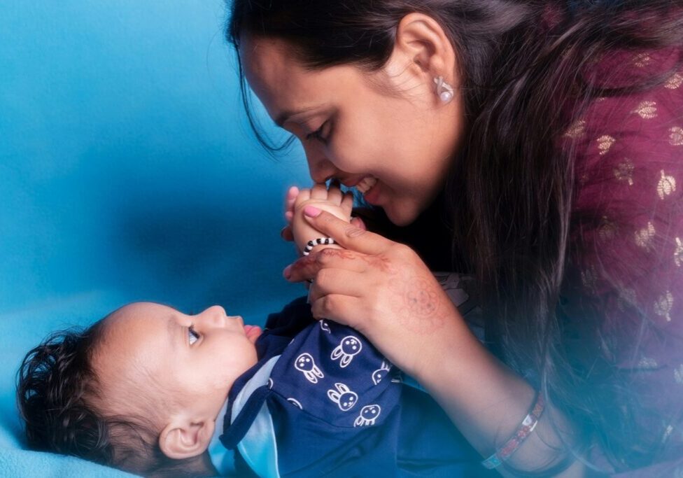 mom looking happily at child