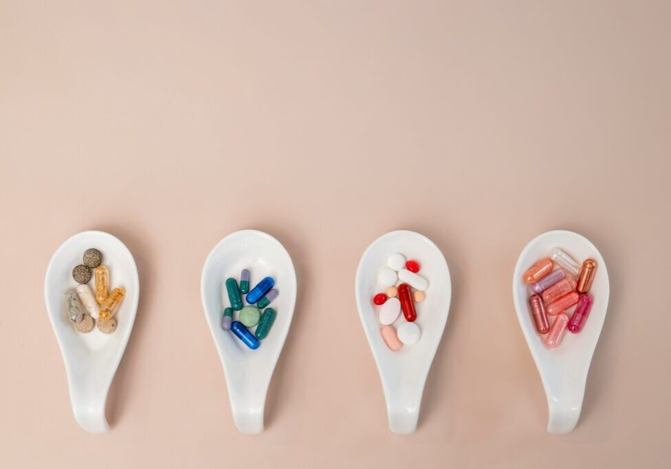 tablets and capsules served on medicine spoons